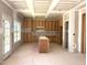 Unfinished kitchen with natural wood cabinets, a central island, and plenty of natural light ready to be customized at 835 Emmett Ct, Spring Hope, NC 27882