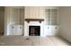 Living room showcasing a fireplace with custom built-in shelving at 835 Emmett Ct, Spring Hope, NC 27882