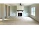 Spacious living room with custom built-in shelving and a cozy fireplace at 835 Emmett Ct, Spring Hope, NC 27882