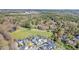 An aerial shot of a neighborhood near wooded areas and open spaces, showcasing its peaceful location at 10 E Madison, Pittsboro, NC 27312