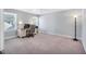 Spacious bedroom featuring neutral decor, ample natural light, and a functional desk area at 10 E Madison, Pittsboro, NC 27312