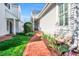 Inviting home features a brick walkway leading to the front door and well-maintained landscaping at 10 E Madison, Pittsboro, NC 27312