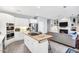 Stylish kitchen featuring a modern island cooktop and a cozy living area with a fireplace at 10 E Madison, Pittsboro, NC 27312