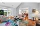 Open-concept view of the living room and dining room with a view of the front door at 10 E Madison, Pittsboro, NC 27312
