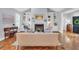 Inviting living room features a fireplace, built-in bookcases, and abundant natural light at 10 E Madison, Pittsboro, NC 27312