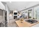 Bright view from kitchen with fireplace, built-in shelving and an outdoor patio at 10 E Madison, Pittsboro, NC 27312