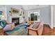 Cozy living room features a fireplace and built-in shelving at 10 E Madison, Pittsboro, NC 27312