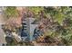Aerial view of roof, deck and driveway showcasing an estate-sized lot filled with mature trees at 101 Barriedale Cir, Cary, NC 27519