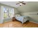 Cozy bedroom with natural light, hardwood floors, and neutral paint, creating a peaceful retreat at 101 Barriedale Cir, Cary, NC 27519