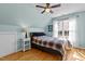 Bedroom with hardwood floors, a ceiling fan, and a cozy atmosphere for restful nights at 101 Barriedale Cir, Cary, NC 27519