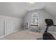 Upstairs bonus room with natural light; ideal for home office or hobbies with bonus storage and work space at 101 Barriedale Cir, Cary, NC 27519