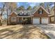 Charming brick home with a well-manicured lawn and a two-car garage, perfect for families at 101 Barriedale Cir, Cary, NC 27519