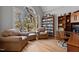 Cozy home office with large arched window, hardwood floors, and built-in bookshelves at 101 Barriedale Cir, Cary, NC 27519