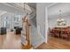 Elegant staircase leading to the second floor, with views of the living room and dining area at 101 Barriedale Cir, Cary, NC 27519