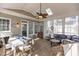 Sunroom featuring a dining and seating area with hardwood floors, filled with natural light at 101 Barriedale Cir, Cary, NC 27519