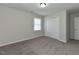 Bedroom featuring neutral walls, plush carpeting and a double closet at 10317 Lake Wheeler Rd, Fuquay Varina, NC 27526