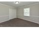 Bedroom featuring neutral walls, plush carpeting and a large closet at 10317 Lake Wheeler Rd, Fuquay Varina, NC 27526