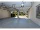 Spacious two-car garage with an epoxy floor, overhead door openers, and view to the exterior at 10317 Lake Wheeler Rd, Fuquay Varina, NC 27526