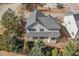Two-story home with covered front porch and fenced-in yard surrounded by mature trees at 104 Bailey Park Ct, Cary, NC 27513