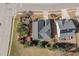 Aerial view of the home showing the roofline, landscaping, and adjacent properties and neighborhood streets at 104 Bailey Park Ct, Cary, NC 27513