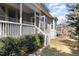 This backyard features steps leading up to a screened in porch at 104 Bailey Park Ct, Cary, NC 27513