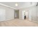 This bedroom features neutral walls, carpet and doors leading to other rooms at 104 Bailey Park Ct, Cary, NC 27513