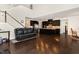 Open concept kitchen with dark wood cabinets, stainless steel appliances, and hardwood floors at 104 Bailey Park Ct, Cary, NC 27513