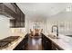 Kitchen with stainless steel gas cooktop and large island with sink at 104 Bailey Park Ct, Cary, NC 27513