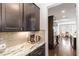 Kitchen view showcasing backsplash, countertop, cabinets, and coffee maker at 104 Bailey Park Ct, Cary, NC 27513