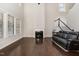 Bright living room featuring a fireplace, large windows, and hardwood floors at 104 Bailey Park Ct, Cary, NC 27513