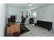 Bedroom with desk, computer, and futon. Good for a home office or flex space at 105 Village Dr, Broadway, NC 27505