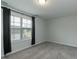 Bedroom showcasing natural light through a large window with blinds and curtains at 105 Village Dr, Broadway, NC 27505