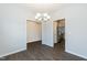 Bright dining room with chandelier and hardwood floors at 105 Village Dr, Broadway, NC 27505