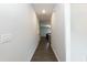 Hallway with hardwood floors, connecting to a spacious living area at 105 Village Dr, Broadway, NC 27505