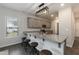 Open kitchen with granite countertops, barstool seating, modern lighting, and stainless steel appliances at 105 Village Dr, Broadway, NC 27505