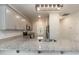 Bright kitchen features granite countertops, stainless steel appliances, and modern overhead lighting at 105 Village Dr, Broadway, NC 27505