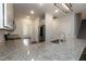 Spacious kitchen with stainless steel appliances, granite counters, and abundant cabinet storage at 105 Village Dr, Broadway, NC 27505