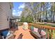 Cozy backyard deck with comfortable seating, a grill, and a view of the landscaped yard at 1052 Mills Street, Raleigh, NC 27608