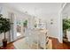 Bright dining room boasts hardwood floors, a view to the backyard, and decorative fixtures at 1052 Mills Street, Raleigh, NC 27608