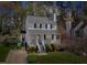 Charming two-story home with a welcoming front porch and well-maintained landscaping at 1052 Mills Street, Raleigh, NC 27608