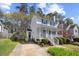 Charming two-story home with a welcoming front porch and well-maintained landscaping at 1052 Mills Street, Raleigh, NC 27608