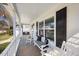 Inviting front porch with rocking chairs and a swing, perfect for relaxing outdoors at 1052 Mills Street, Raleigh, NC 27608