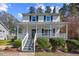 Inviting front porch with rocking chairs and a swing, perfect for relaxing outdoors at 1052 Mills Street, Raleigh, NC 27608