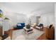 Open concept living room with lots of natural light, hardwood flooring, and neutral paint at 1052 Mills Street, Raleigh, NC 27608