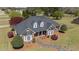 Brick home featuring dormer windows and a curved driveway at 1055 Tilghman Rd, Dunn, NC 28334