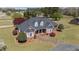 Brick home featuring dormer windows and a curved driveway at 1055 Tilghman Rd, Dunn, NC 28334