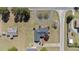 Stunning aerial view of landscaped property with circular drive and mature trees at 1055 Tilghman Rd, Dunn, NC 28334