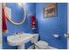 Powder room with modern fixtures, and classic pedestal sink at 1055 Tilghman Rd, Dunn, NC 28334