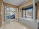 Bright bathroom features a soaking tub with views and access to the bedroom at 1055 Tilghman Rd, Dunn, NC 28334