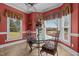 Cozy breakfast nook with bright natural light and charming backyard views at 1055 Tilghman Rd, Dunn, NC 28334